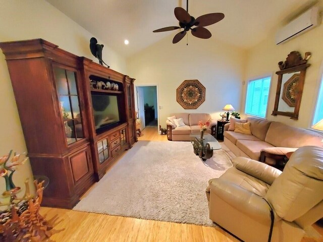124 Collette Rd, Holden, ME 04429 - living room with an AC wall unit, ceiling fan, light wood-style flooring, and high vaulted ceiling