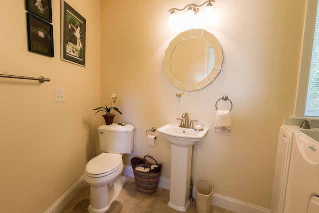 bathroom featuring tile patterned floors and toilet