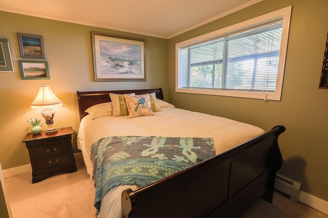 bedroom featuring baseboard heating, ornamental molding, and carpet flooring