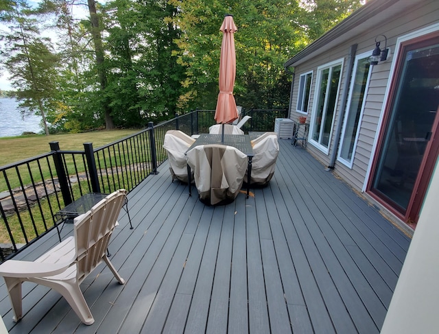 wooden deck with a lawn