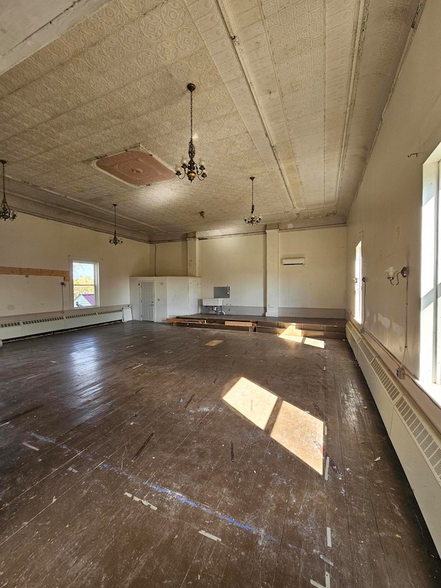 interior space with baseboard heating and dark wood-type flooring