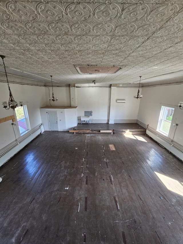562 Ledge Hill Rd, Corinth, ME 04427 - unfurnished living room featuring an ornate ceiling, hardwood / wood-style flooring, and a baseboard radiator