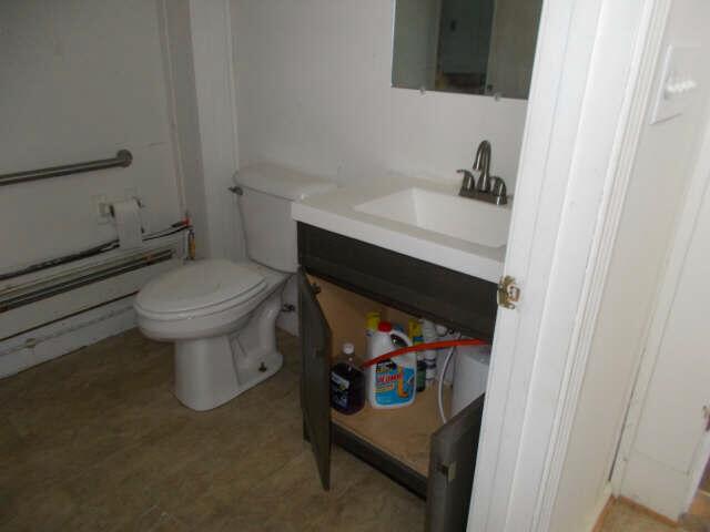 562 Ledge Hill Rd, Corinth, ME 04427 - half bathroom featuring toilet and vanity