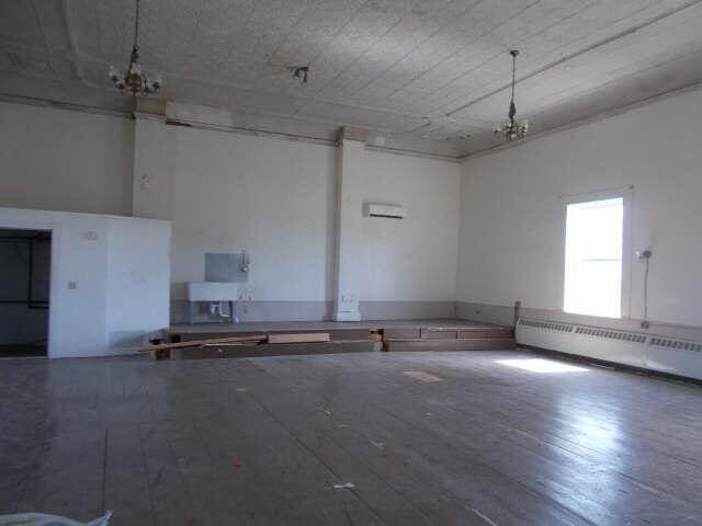 562 Ledge Hill Rd, Corinth, ME 04427 - unfurnished room with an inviting chandelier and a baseboard radiator