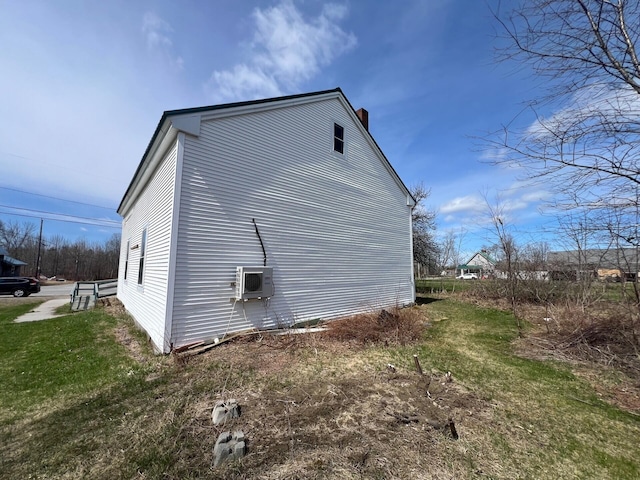 562 Ledge Hill Rd, Corinth, ME 04427 - view of home's exterior featuring ac unit and a chimney
