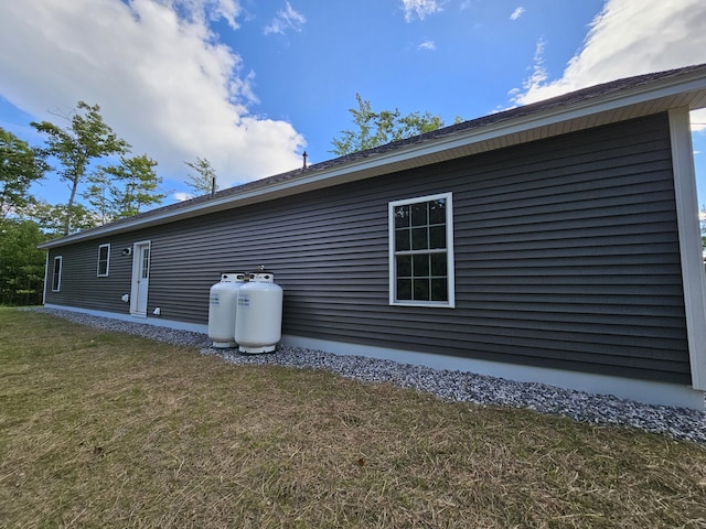 view of home's exterior featuring a yard