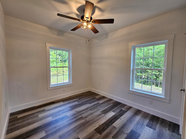 unfurnished room with dark hardwood / wood-style floors and ceiling fan