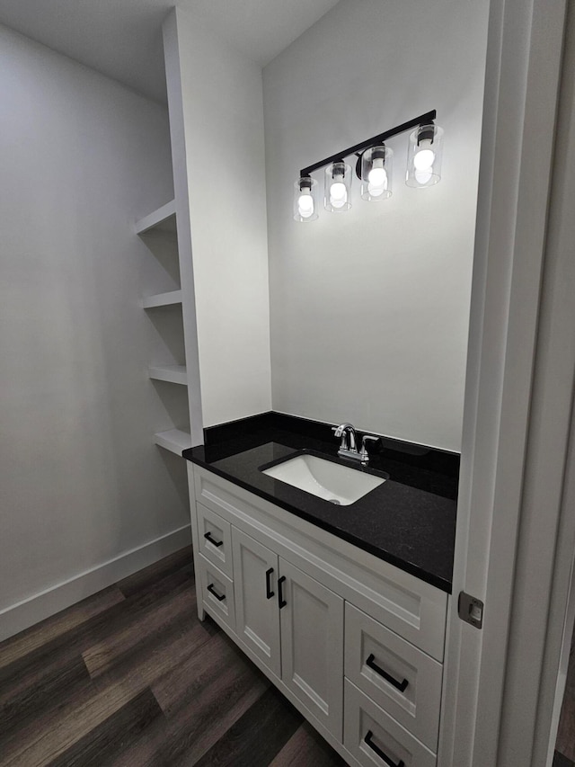 bathroom with vanity and hardwood / wood-style floors