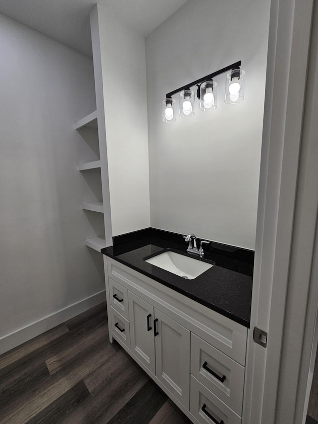 bathroom featuring vanity and wood finished floors