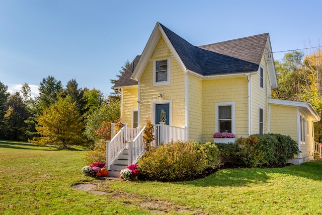 view of front of home with a front yard