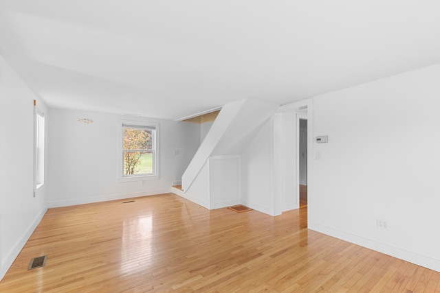 bonus room featuring light wood-type flooring