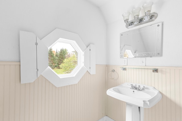 bathroom with lofted ceiling