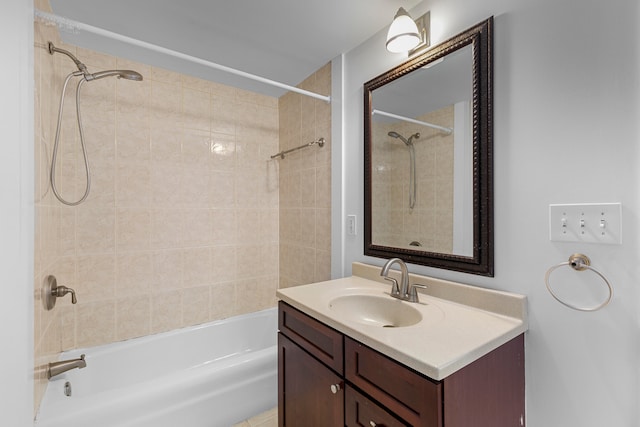 bathroom featuring vanity and tiled shower / bath combo