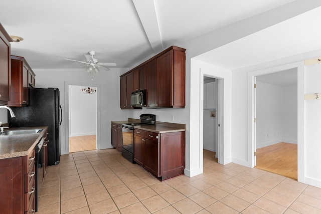 kitchen with black appliances, sink, lofted ceiling, ceiling fan, and light hardwood / wood-style flooring