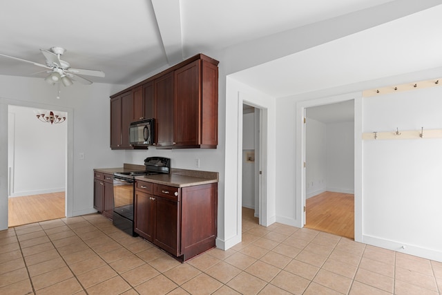 kitchen featuring light hardwood / wood-style flooring, black appliances, and ceiling fan