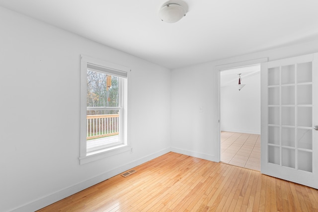 unfurnished room with wood-type flooring