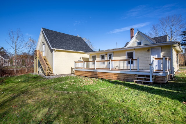 back of house featuring a yard and a deck