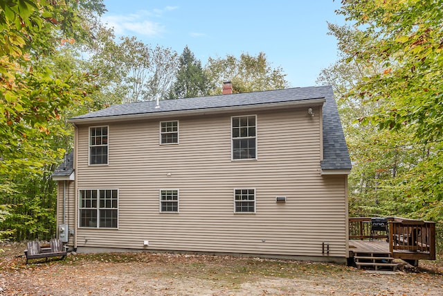 view of side of property featuring a deck