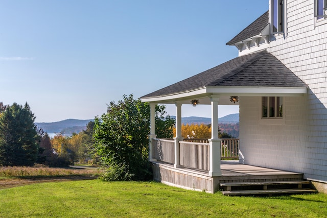 view of yard with a gazebo and a deck with mountain view