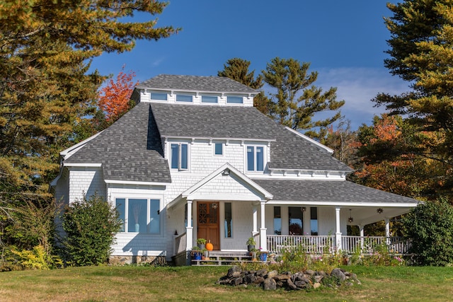 view of front of home featuring a porch and a front yard