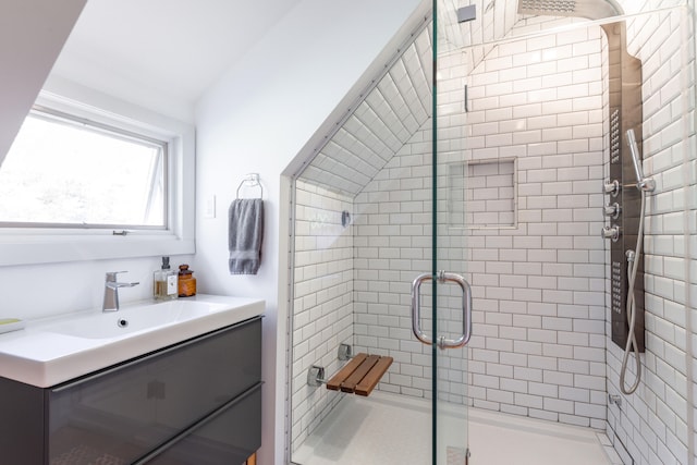 bathroom with vanity and a shower with shower door