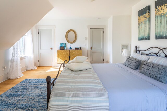 bedroom with light hardwood / wood-style floors