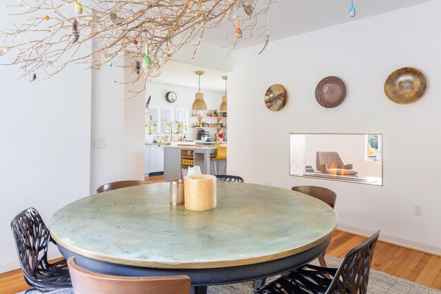 dining space with light wood-type flooring