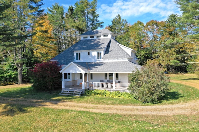 view of front of home featuring a porch and a front yard