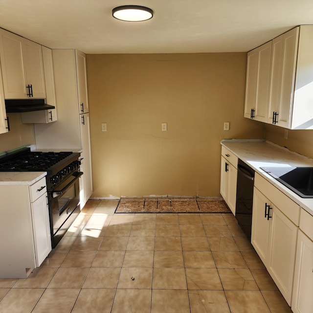 kitchen with stainless steel range, black dishwasher, and white cabinets