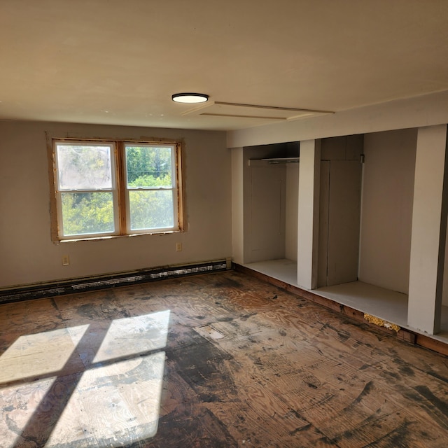 unfurnished bedroom with a baseboard radiator