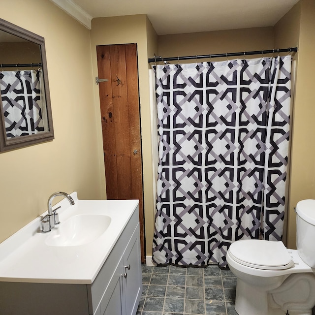 bathroom featuring vanity and toilet