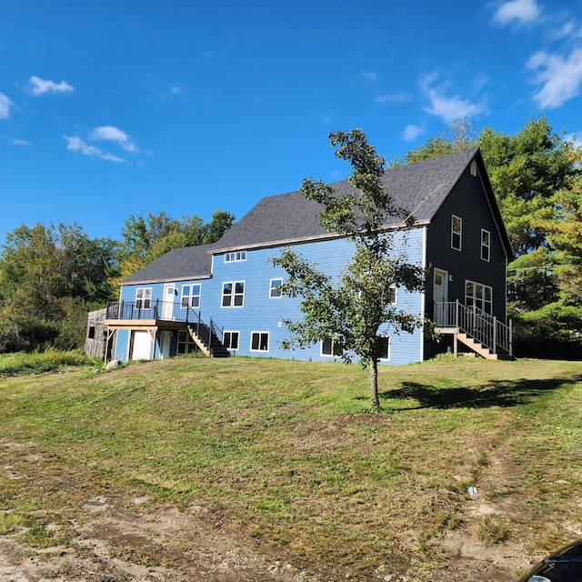 view of home's exterior featuring a yard and a wooden deck