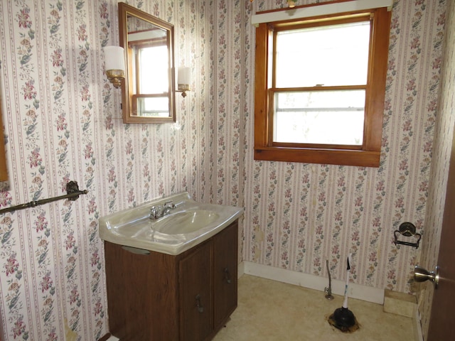 bathroom featuring a healthy amount of sunlight and vanity