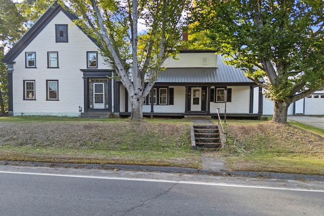 view of front of house with a garage and a porch