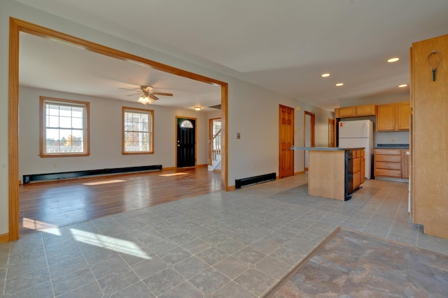 20 Kristas Way, Gorham, ME 04038 - kitchen featuring freestanding refrigerator, open floor plan, a kitchen island, a baseboard radiator, and recessed lighting