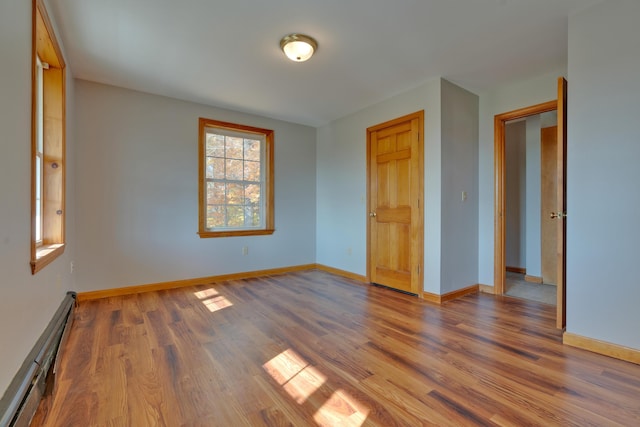 20 Kristas Way, Gorham, ME 04038 - unfurnished room with a baseboard radiator and wood finished floors