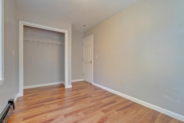 20 Kristas Way, Gorham, ME 04038 - unfurnished bedroom featuring baseboard heating, light wood-type flooring, and a closet