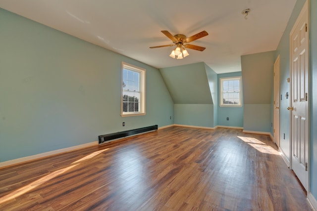20 Kristas Way, Gorham, ME 04038 - bonus room with baseboard heating, ceiling fan, wood finished floors, and vaulted ceiling