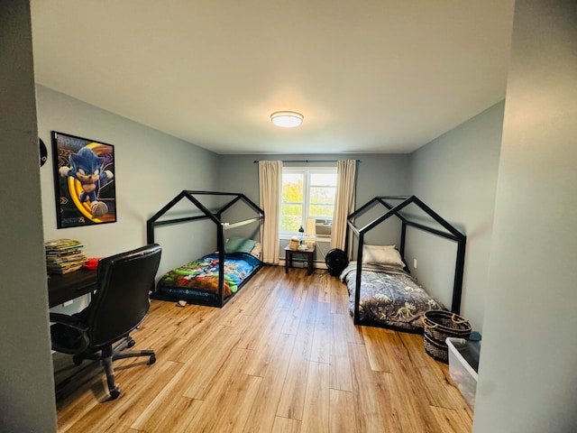 bedroom featuring light wood-style flooring