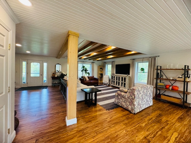 living room with recessed lighting, beamed ceiling, baseboards, and wood finished floors