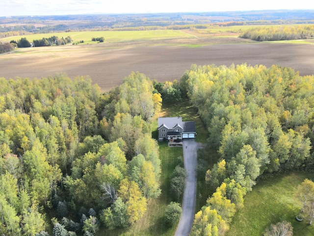 drone / aerial view with a rural view and a wooded view