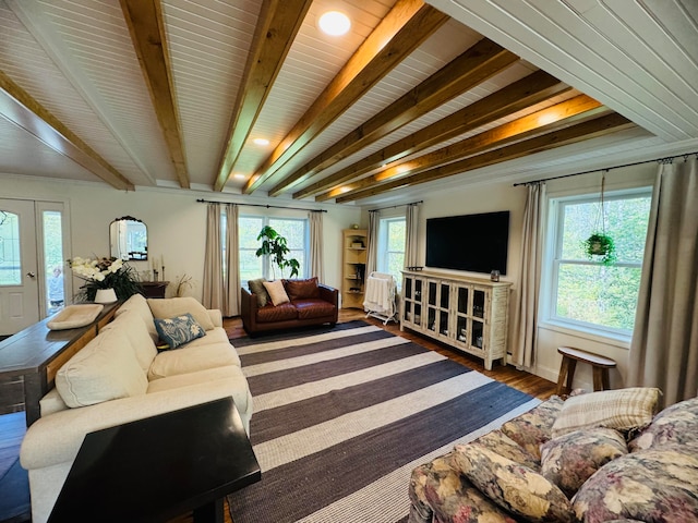 living room featuring beamed ceiling and wood finished floors