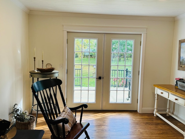 doorway with french doors, baseboards, wood finished floors, and ornamental molding