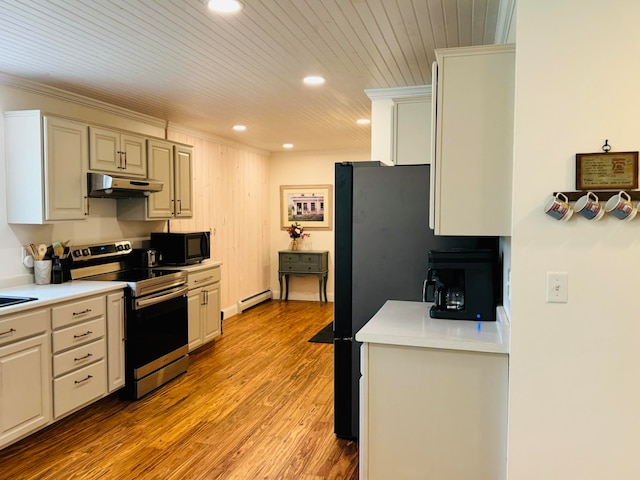 kitchen with under cabinet range hood, a baseboard heating unit, light wood-style floors, black microwave, and stainless steel electric range oven