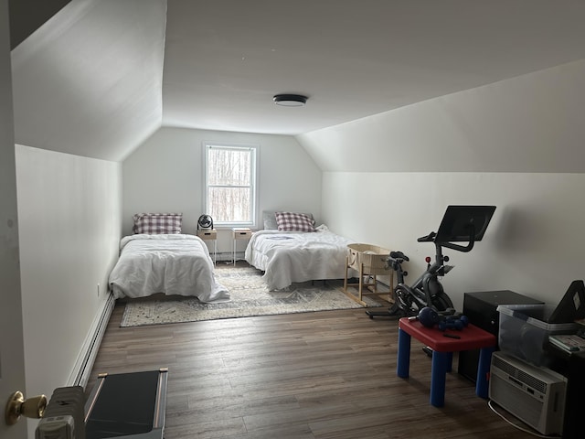 bedroom featuring vaulted ceiling and wood finished floors