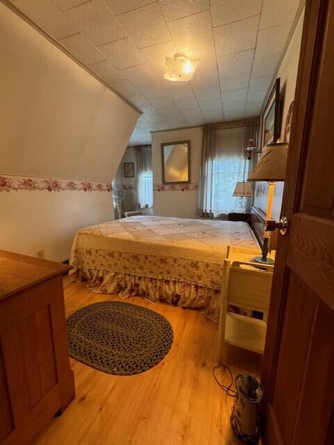 bedroom with light wood-style flooring