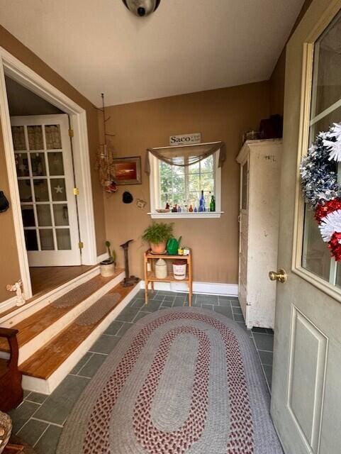 interior space featuring tile patterned floors and baseboards