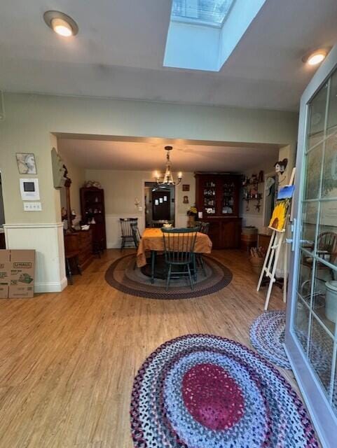 dining space with wood finished floors