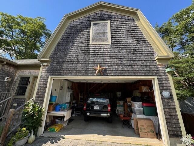 exterior space with driveway and an attached garage