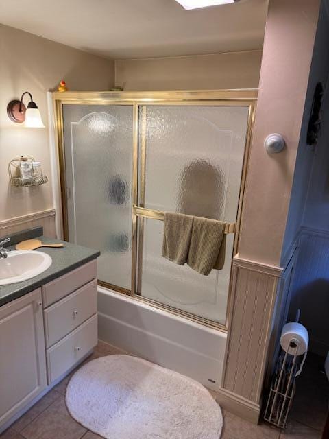 full bathroom with tile patterned floors, vanity, and enclosed tub / shower combo